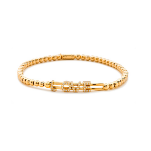 Hulchi Belluni Tresore 18k yellow gold stretch bracelet with sliding 0.13ct. diamonds that spell out the word “LOVE”. Diamonds have G color and VS clarity.