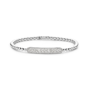 This 18kt white gold Hulchi Belluni Tresore stretch bracelet features 11 round diamonds in a diamond halo of 56 round brilliant diamonds totaling .92ctw.